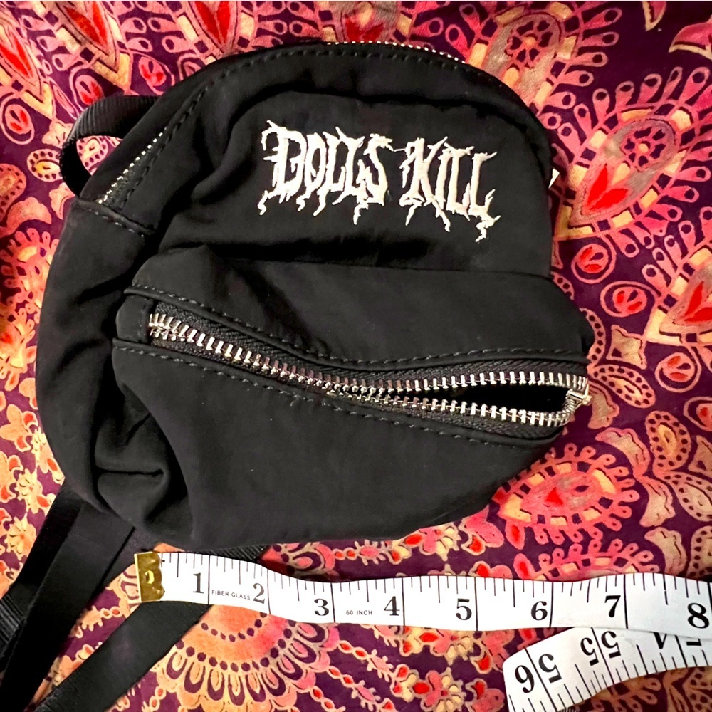 Dolls Kill • Logo Black Mini Backpack with silver exposed zipper, adjustable